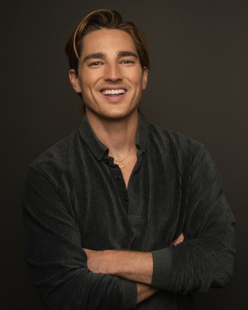 Brandon Keith Rogers smiling, black shirt